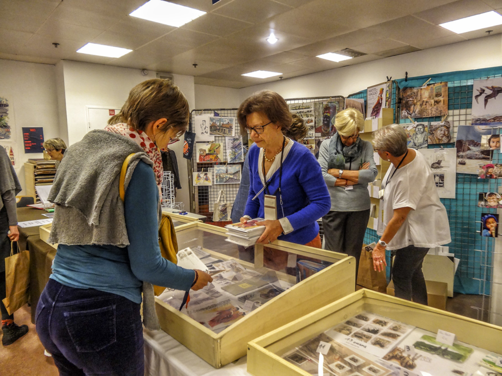 An ANUVAM member is part of the team that runs the Rendez-Vous du Carnet de Voyage shop.